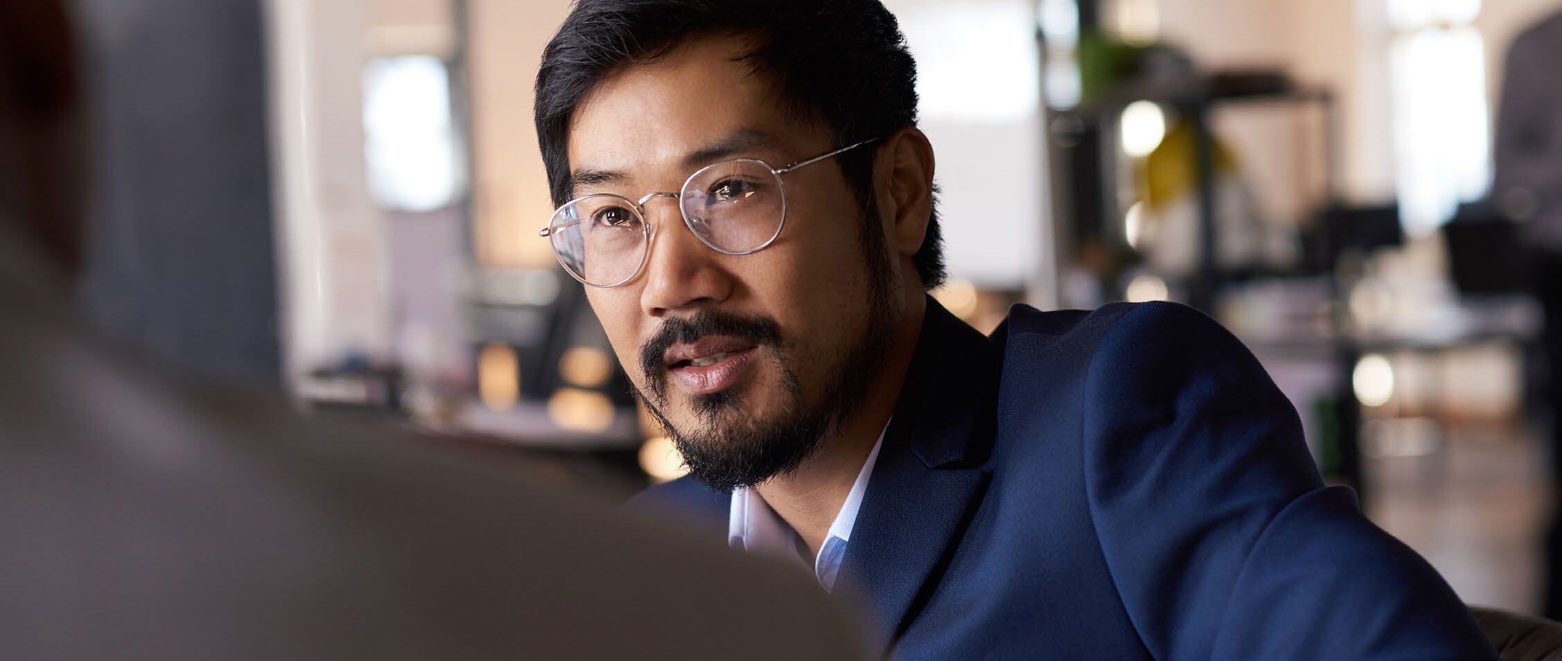 Man wearing glasses talking