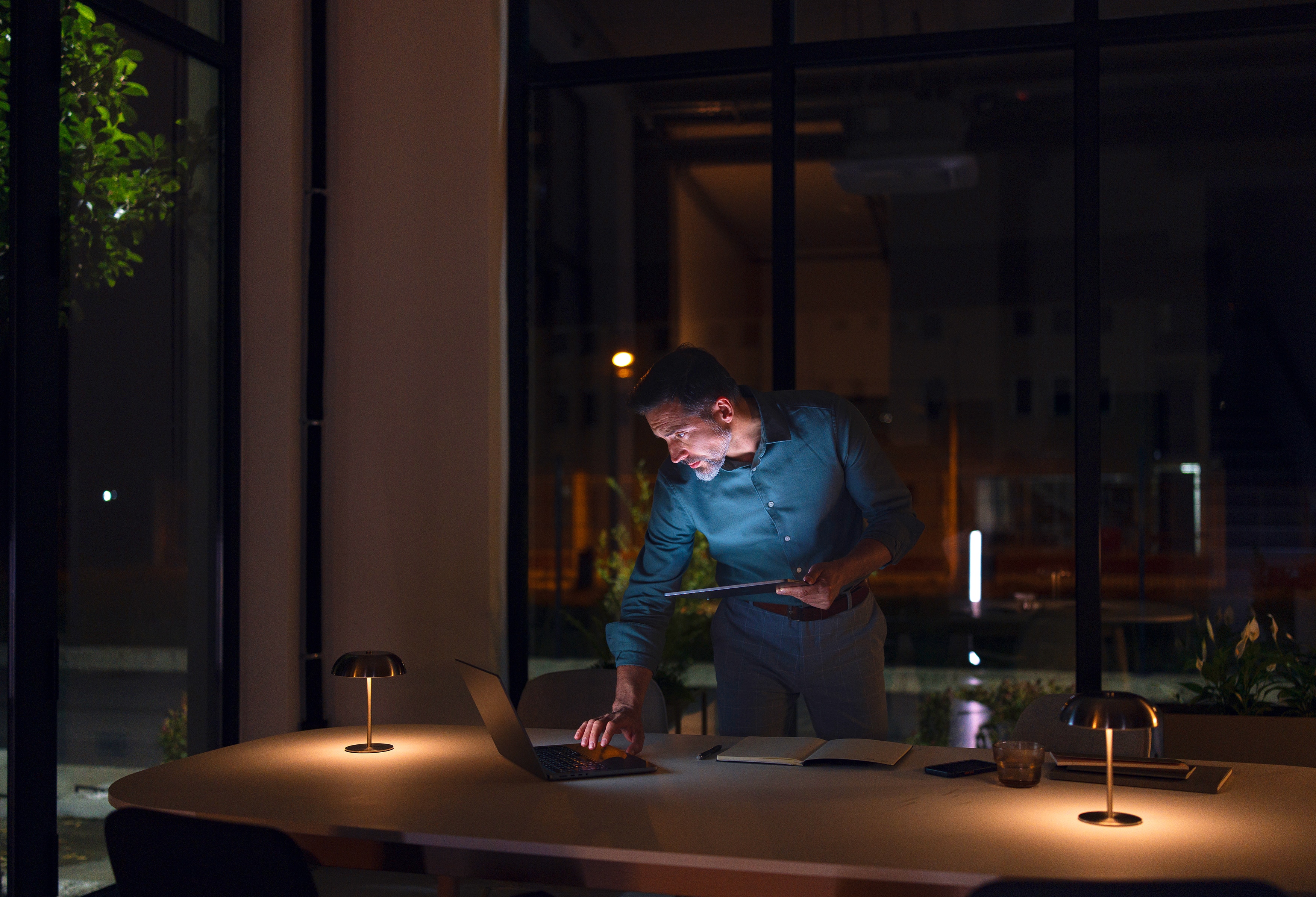 Man working in an office late at night