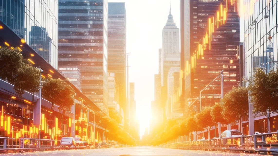 long road with buildings with sunset in distance 